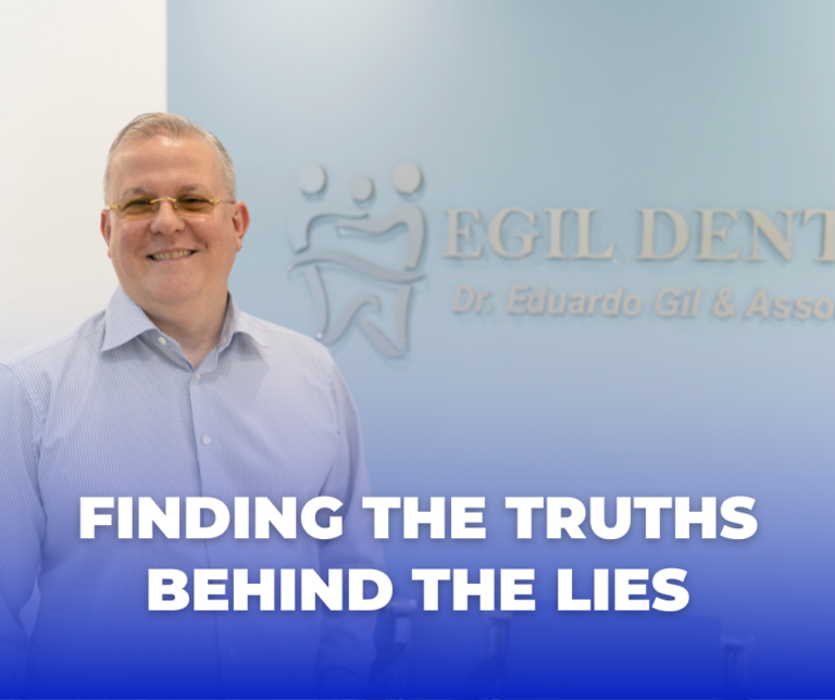 a man wearing glasses and smiling